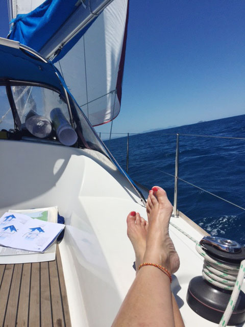 Relaxing under sail in the Whitsundays on a Charter Yachts Australia bareboat